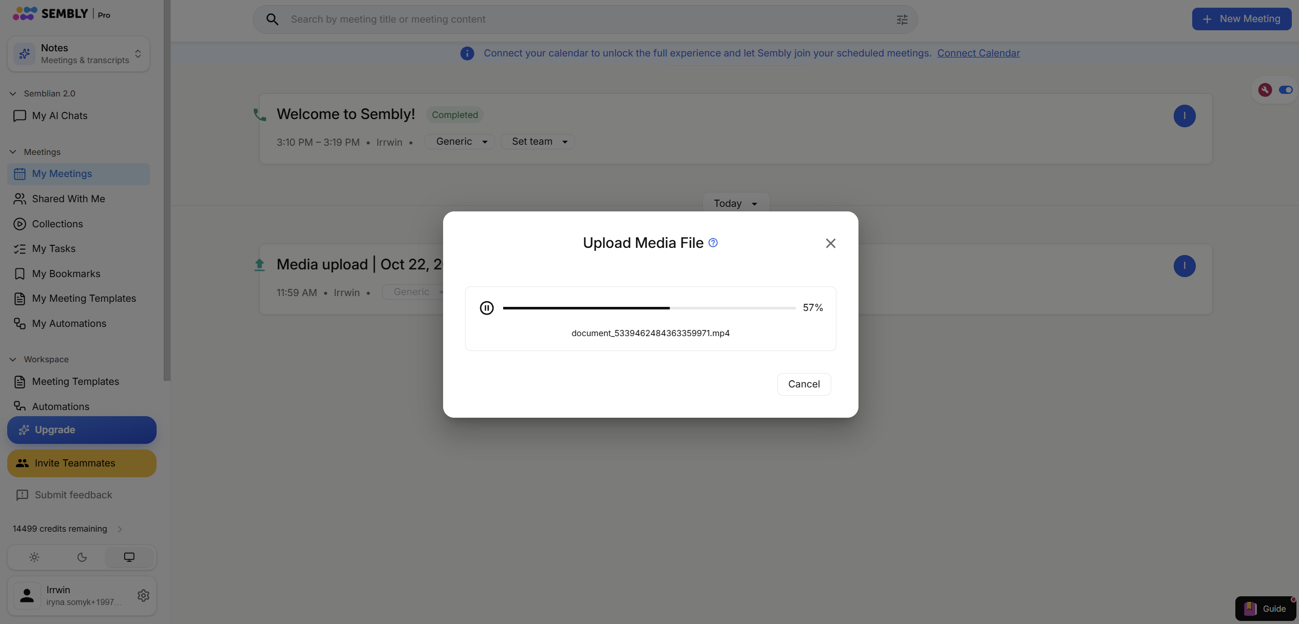The Upload Media File dialog is open over the My Meetings screen, showing a video upload at 57% with pause and Cancel controls. Visible: Upload Media File, 57%, document_5339462484363359971.mp4, Cancel, My Meetings, Search by meeting title or meeting content.
