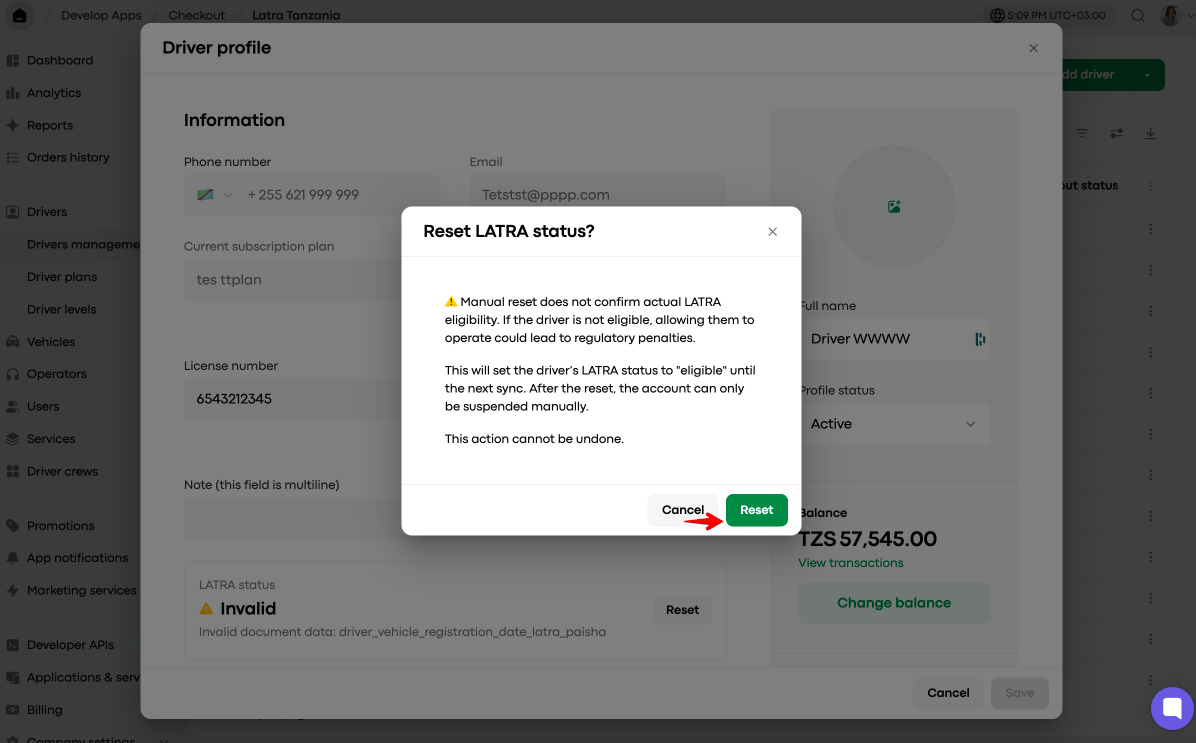 A Reset LATRA status confirmation dialog overlays the Driver profile screen; a red arrow points to the green Reset button. Visible: Driver profile, Reset LATRA status?, Manual reset does not confirm actual LATRA eligibility., This action cannot be undone., Cancel, Reset.