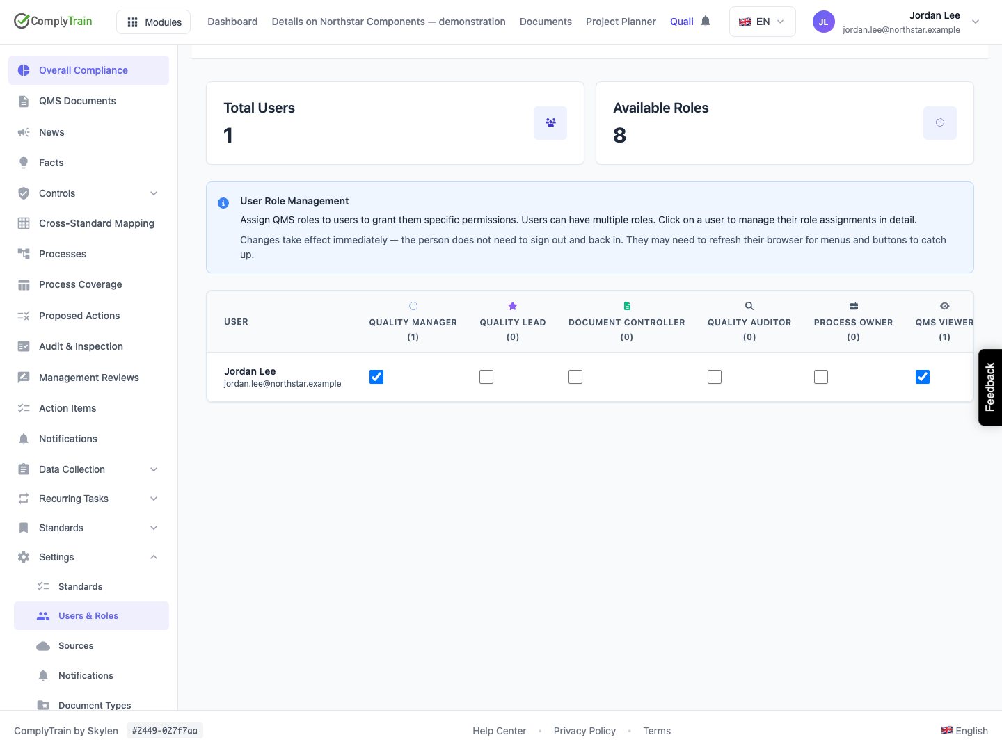 Confirm the saved roles after refreshing The refreshed row shows both Quality Manager and QMS Viewer selected. A viewing role does not remove permissions supplied by a stronger role.